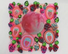 A small painting of a strawberry moon surrounded by strawberries on a 4 inch square wooden panel, with hand embroidered strawberries attached. 