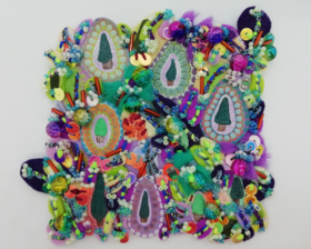 Inspired by nature, this is a colourful abstract textile art with painted green trees and hand sewn fabrics with beading on a small 4 inch canvas panel