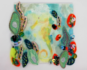 A small painting of a yellow seahorse surrounded by hand stitched textiles and beads on a square 4 inch wooden panel